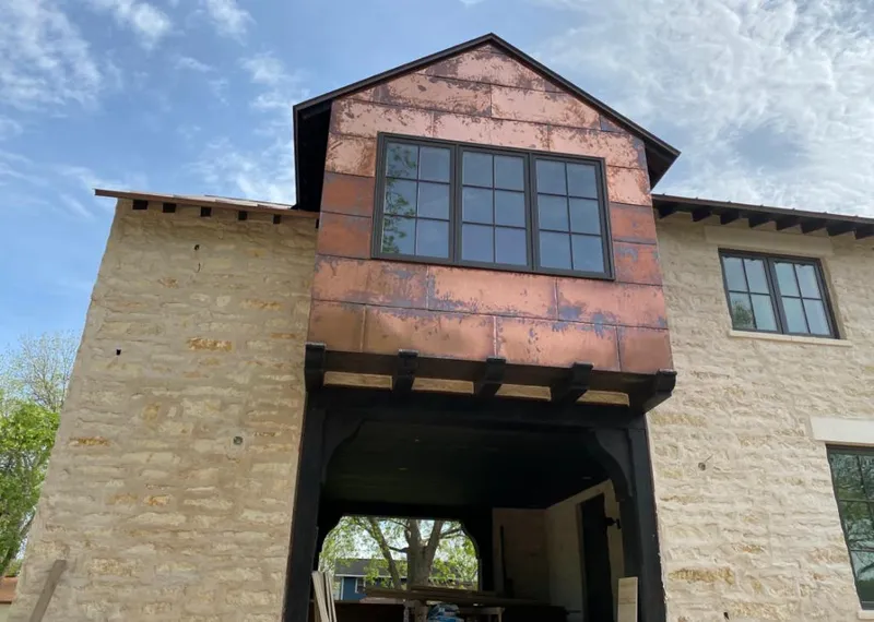 Copper metal panel facade on a stone building for Skylight Installation in Massapequa Park